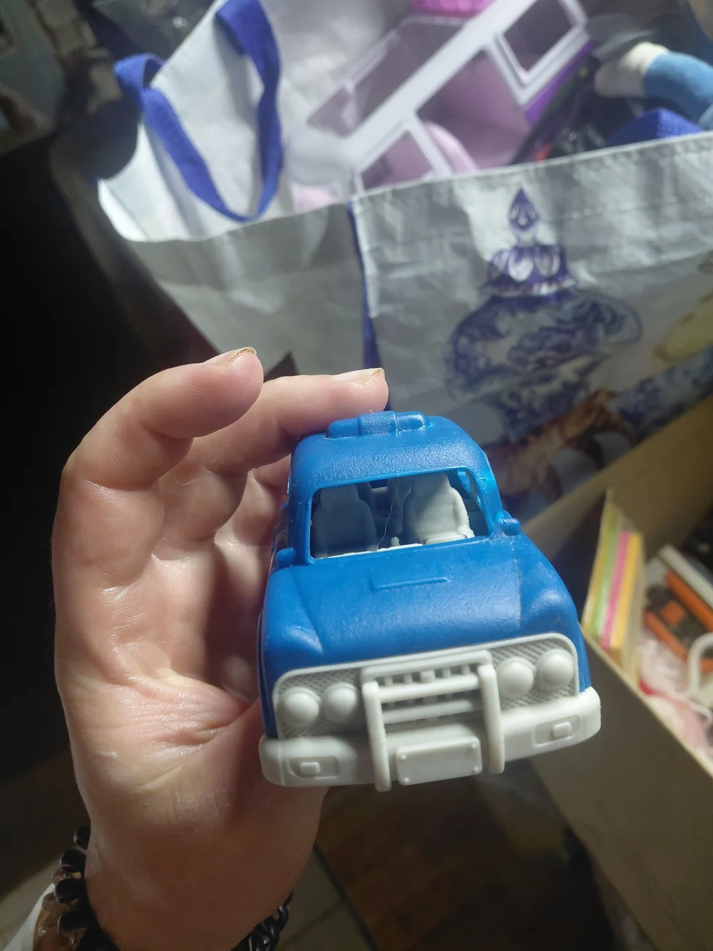 blue and white B. toys Happy Cruisers mini car toy toddlers.  Police car